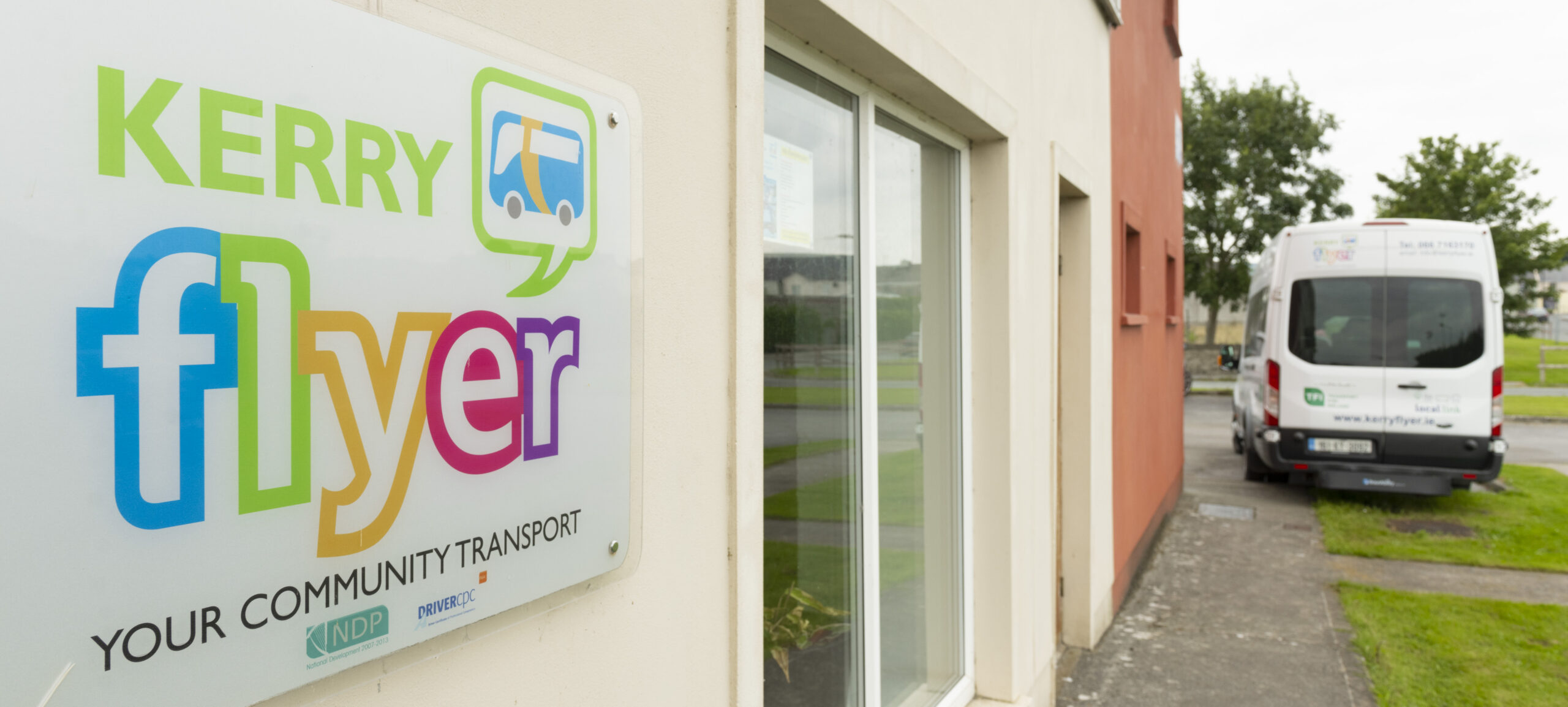 Image displays kerry flyer office building with the logo on the wall