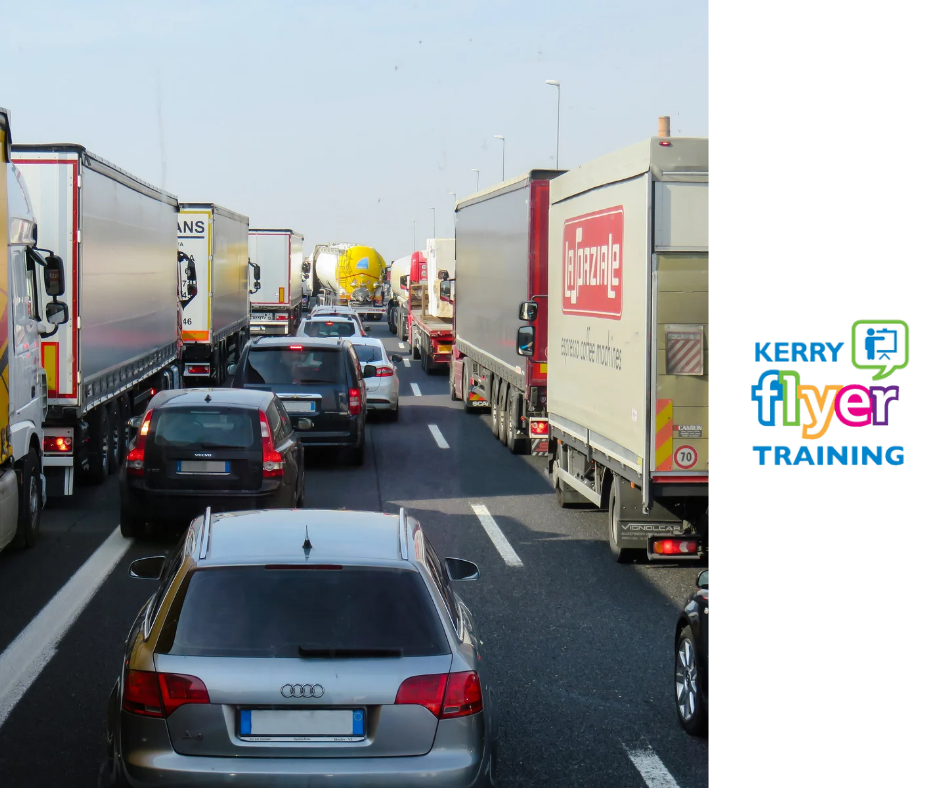 image displaying cars and trucks in traffic on a motorway 